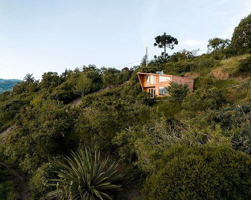 uniform skin of bricks coats casa perucho's facades in ecuador