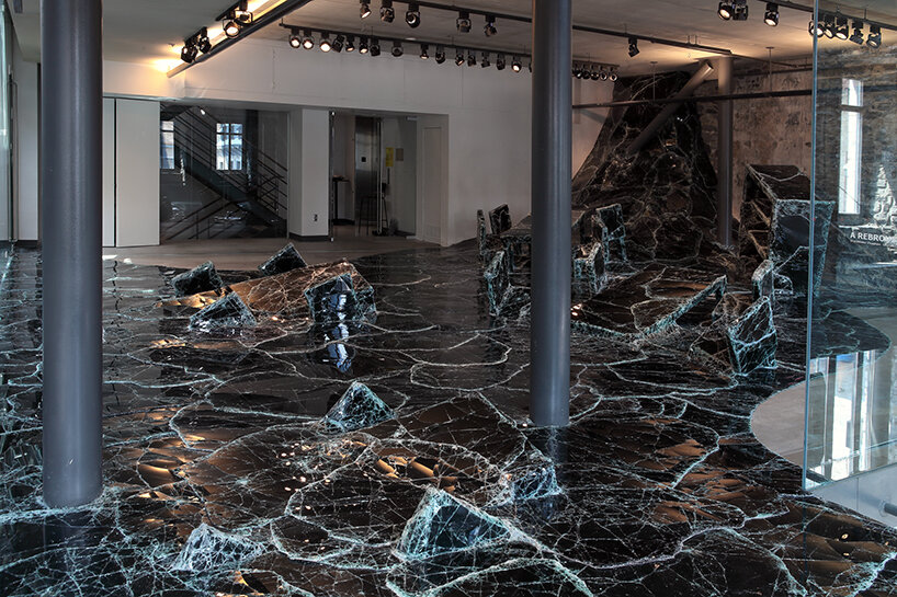 dark tide: baptiste debombourg's broken black glass installation