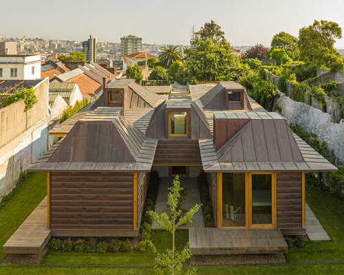 carlos castanheira's H-shaped fontinha house nestles in a private garden in portugal