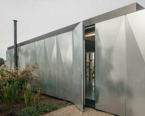 FELT extends traditional flemish home with wedge-shaped, metal-clad library in belgium