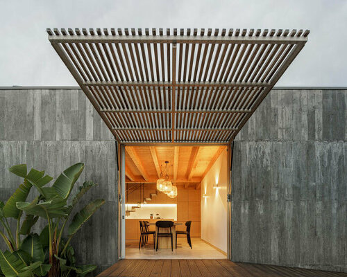 pedro henrique's palheiro beach house disguises solid concrete as wood