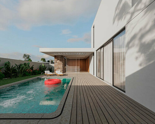 white cantilever glazed volume stands on stone plinth in cyprus