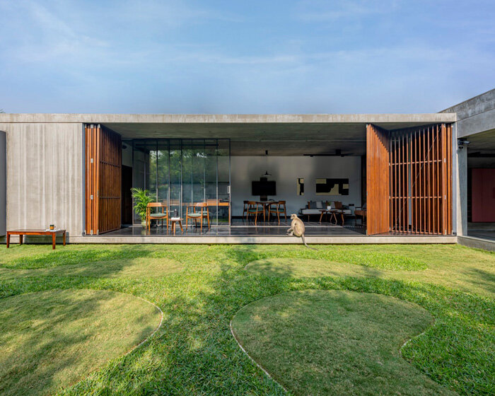 workspace in india showcases a material palette of wood, concrete, and kota stones