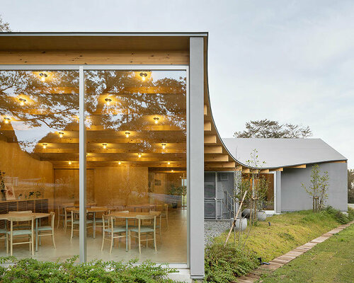 two inverted vaults top takashige yamashita's boutique hotel entrance in japan