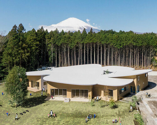 takashige yamashita's ‘children’s forest’ kindergarten is backdropped by mount fuji