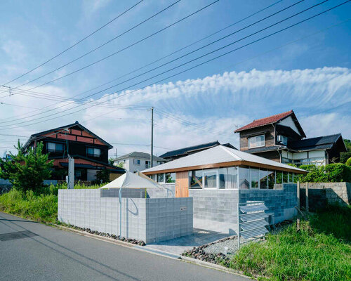 concrete blocks and angled timber beams shape up weekend house in kyoto