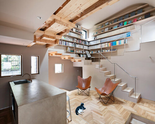 built for cats, tan yamanouchi's japanese home unfolds around a playful spiral staircase