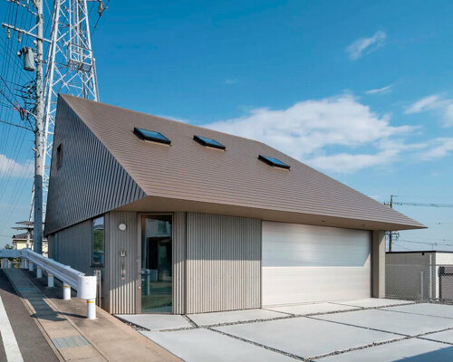 waved steel sheets enfold industrial-styled residence by slow architects