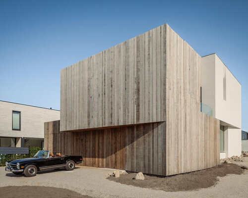 wooden cladding and lime plaster cover the solid form of villa k340 in the netherlands