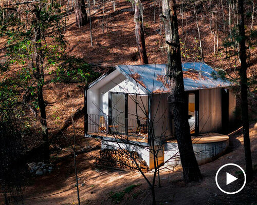 an ensemble of wooden, steel and concrete cabins composes glamping resort by S-AR