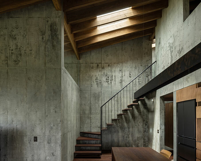 house in toguchi brings concrete architecture to lush japanese island