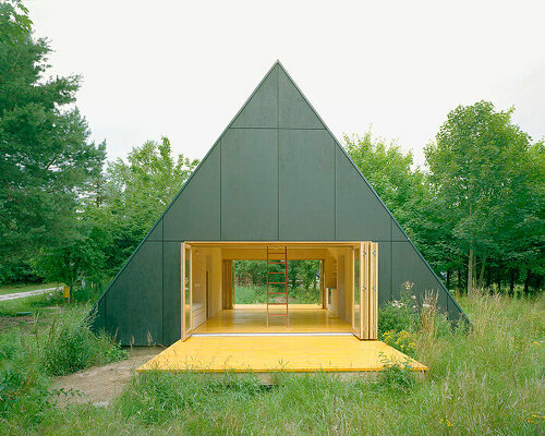 primary colors imbue the wooden A-frame house wolin in poland