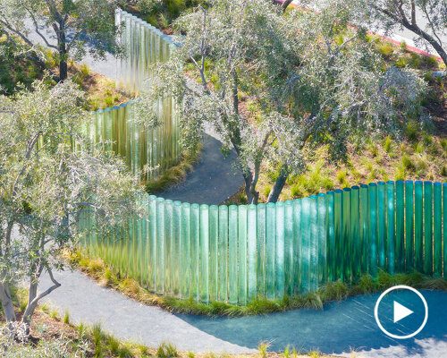 apple park's mirage sculpture takes shape as iridescent glass pillars winding through trees