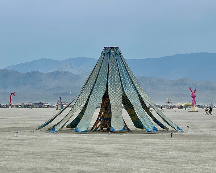 MIT's living knitwork pavilion at burning man lights up at night & interacts with people's dance