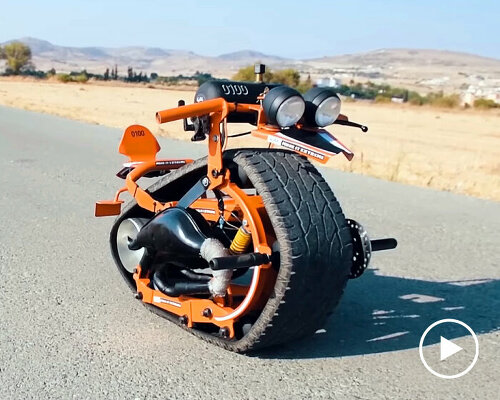 mini motorbike with single recycled car tire around its body can lean back for wheelie stunts