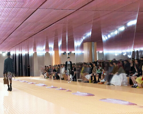 prada SS24 womenswear show sees slime dripping from the deposito's pink-hued ceiling