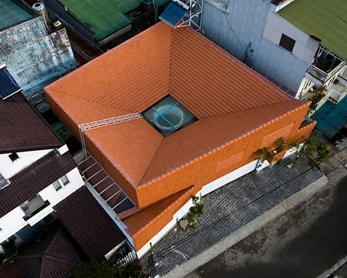 the bloom architects' tile-wrapped house regulates vietnam's tropical and temperate climate