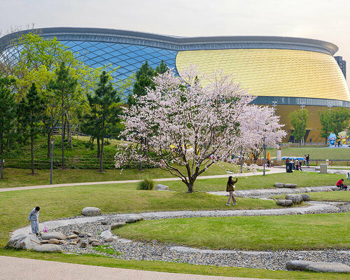 archi-tectonics' hybrid stadium in hangzhou takes cues from the chinese cong