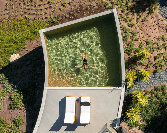 set like a bending body, mutant's casa de bouro seemingly hugs the portuguese landscape