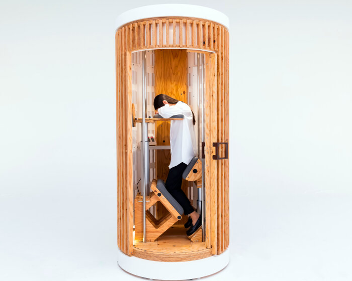 standing sleeping pods help people take power naps on their feet while in the office or cafés