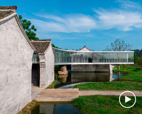 curved bridge corridor links two historic houses on chinese lakeside