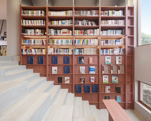 li city study invites 24/7 reading amid a terracotta-hued & skylit backdrop in china