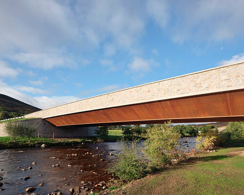 moxon's new granite and steel bridge in rural scotland stands alongside historic crossing