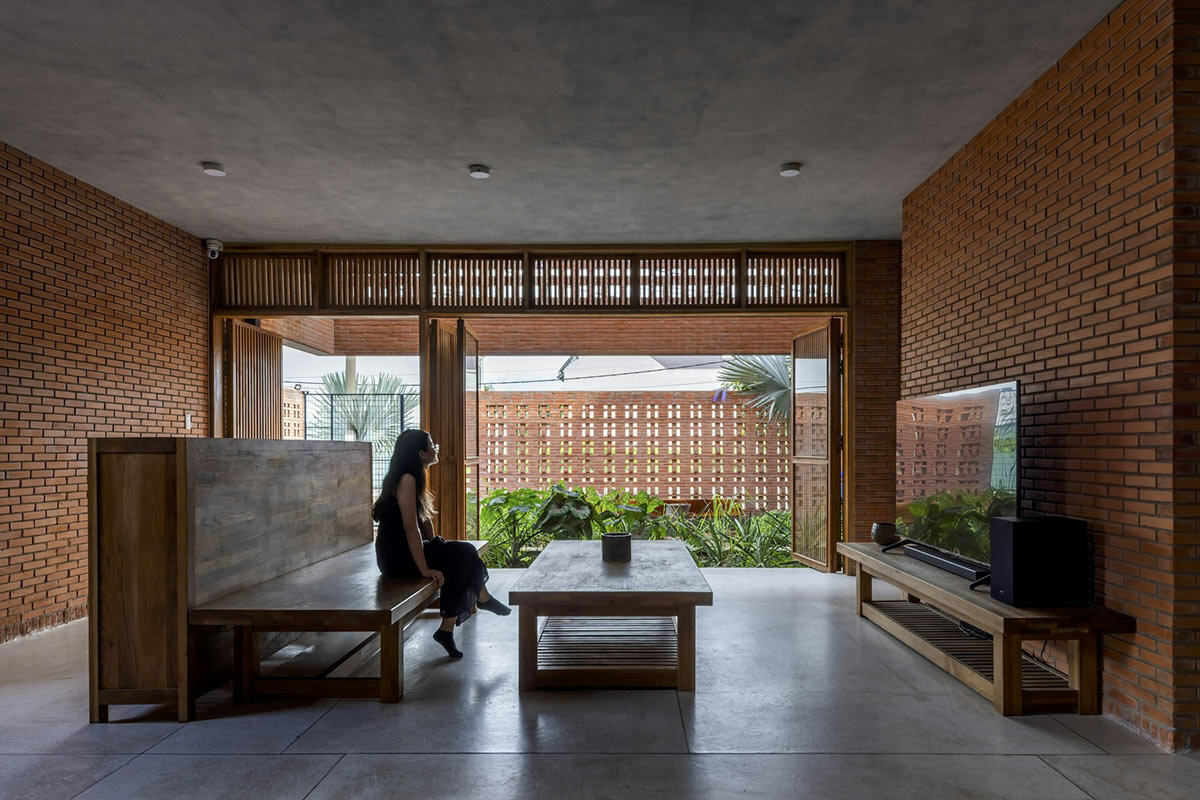 perforated brick facade veils tropical space's nhà bè house