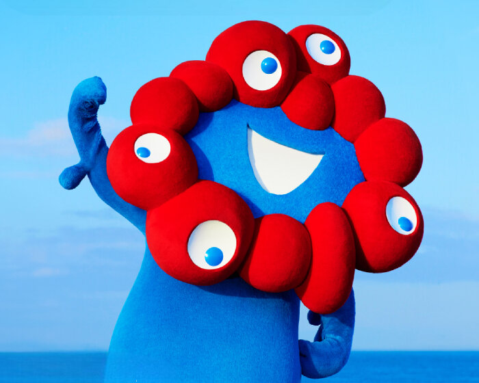 meet myaku-myaku, expo 2025 osaka’s mascot with rolling eyeballs and sunflower-like head