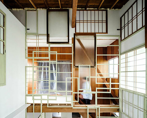 repurposed window frames in green pastel add a splash of brightness to OTA's house in japan