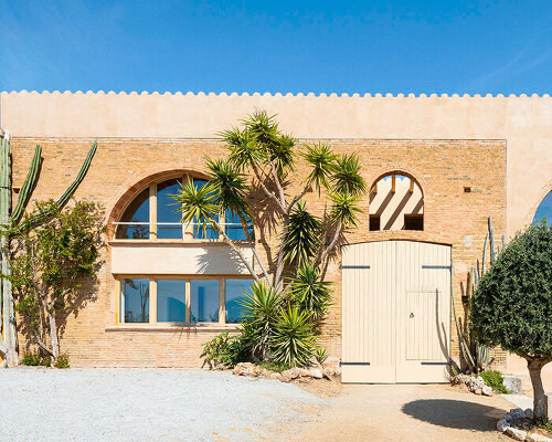 sheep barn in spain transforms into family home preserving original brick-clad arches