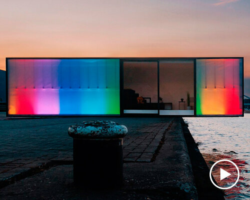 rainbow LED display illuminates the exterior of compact box studio in belgium