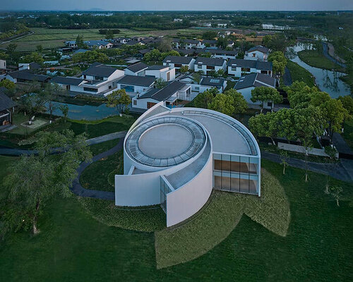 spiral gallery by protoscapes unravels like a white flower in rural china