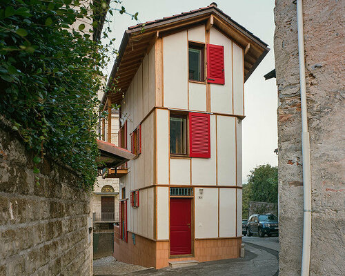 studio albori rebuilds this 'casa di legno e paglia' with larch wood and hay