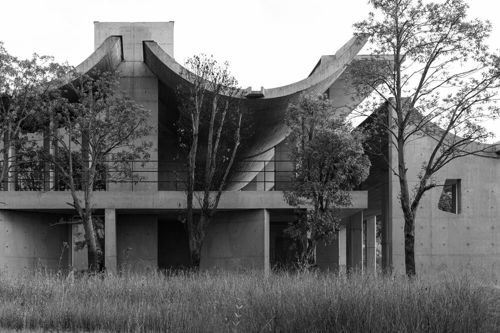 imposing inverted arches top studio zhu pei's international conference ...