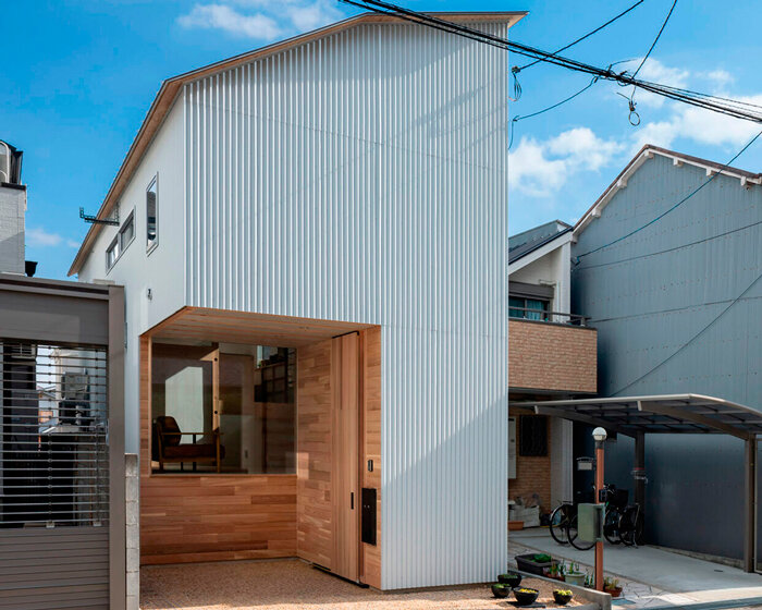 interconnected skipped floors outline the interior of compact toneyama house in japan