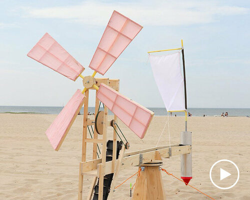 taiyi yu’s windmill on the beach rotates in the breeze to create an imprint in the sand