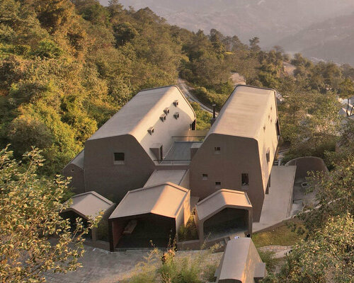 MAP's cloud catcher emerges from nepal hillside resort as two rock-like volumes