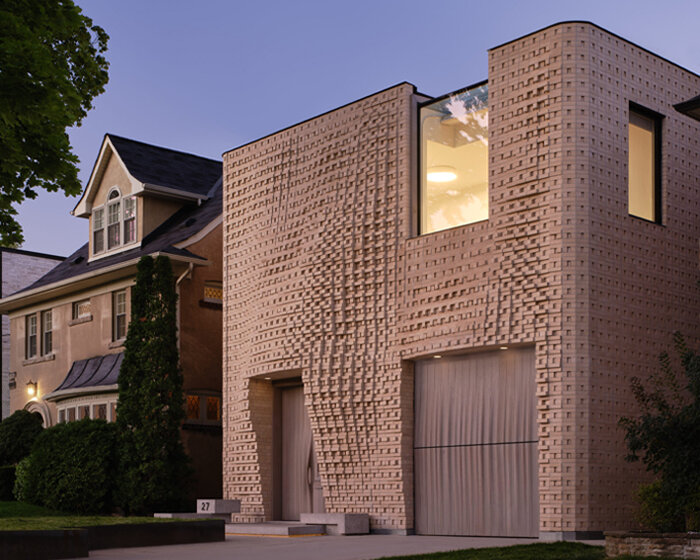 dramatic brick undulations flow across partisans' canvas house in toronto, canada