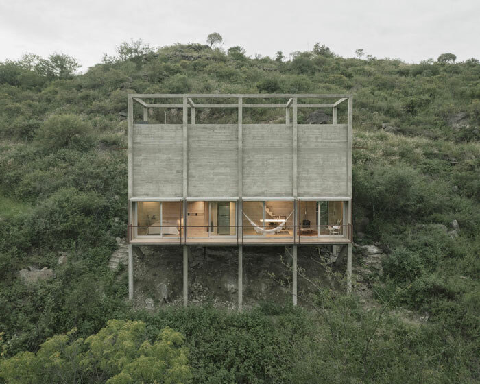 concrete 'casa taller' rises from the treetops of la paisanita, argentina