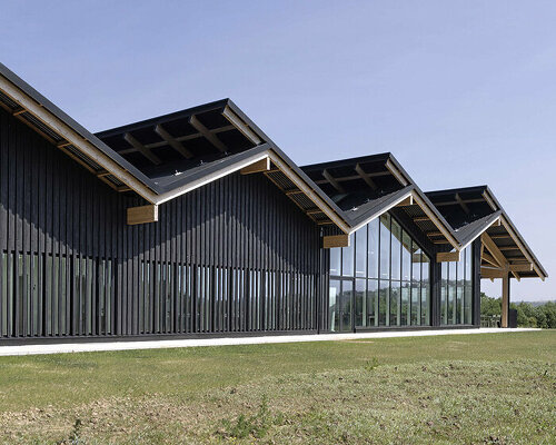 coldefy envelops double-sloped hermès factory in ardennes with burnt wood cladding