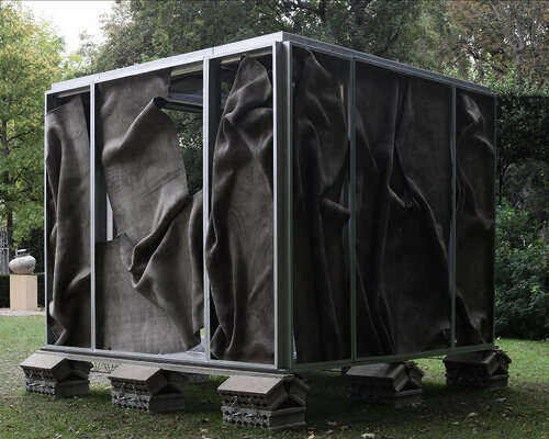 crumpled cement drapes over function-free pavilion X