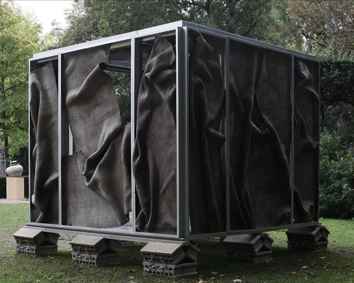 crumpled cement drapes over function-free pavilion X in paris