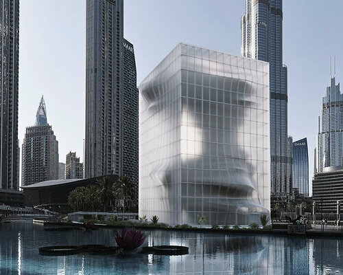 semi-transparent membrane wraps the sculptural body of dubai art museum