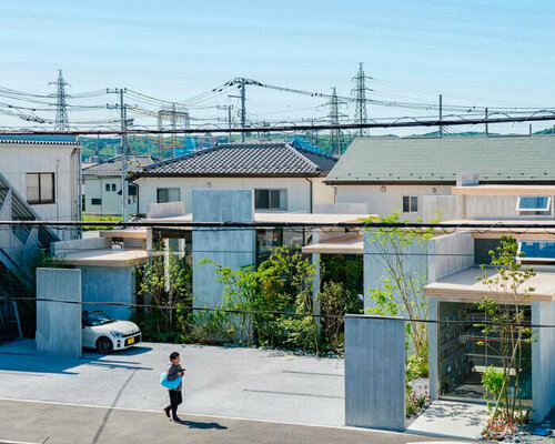 layers of wooden, concrete and mirrored surfaces combine to compose hair salon in japan