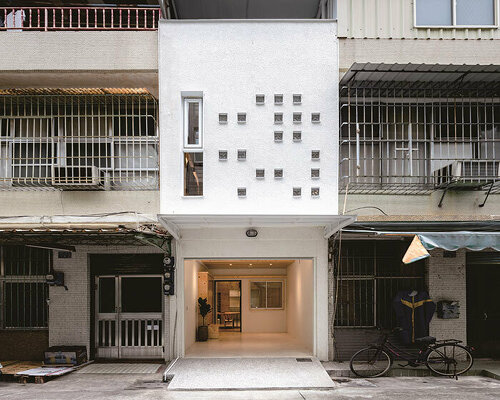 speckled windows illuminate TYarchistudio's renovated 'house OO' in taiwan