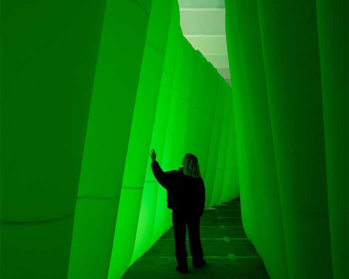 colossal inflatable landscape transforms dutch design week with organic neon green forms