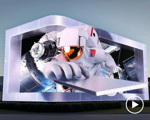 NASA details its history using 3D movie projected on billboard at kennedy space center