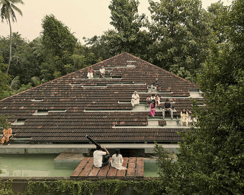 a tiled rooftop amphitheater encloses wallmakers' nisarga art hub in india