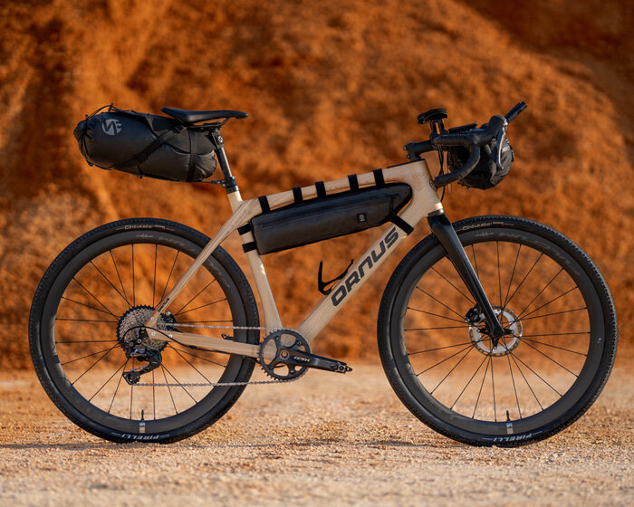 crafted from laminated ash wood layers, ornus bike absorbs vibrations for a smoother ride